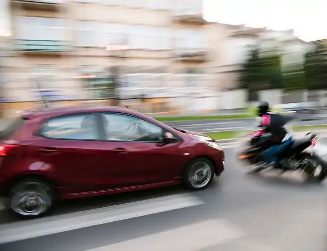 Car and motorcycle about to collide in Beverly Hills