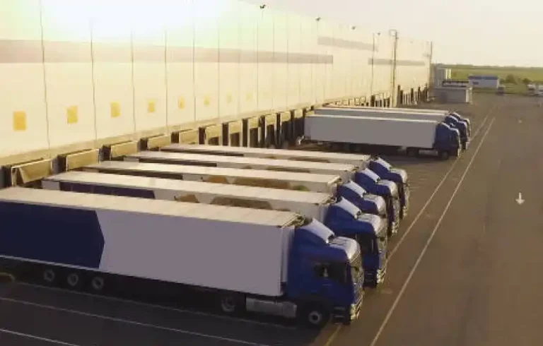 Fleet of commercial trucks at a loading dock highlighting corporate liability risks