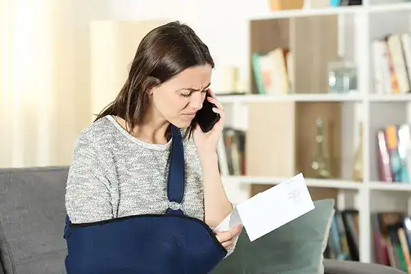 Injured worker reviewing documents after an accident