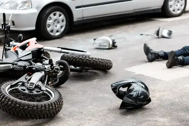 Motorcycle accident victim on the ground after an accident in Fresno