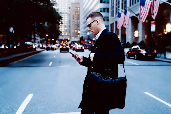 Pedestrian accident risks with man walks while busy on the phone