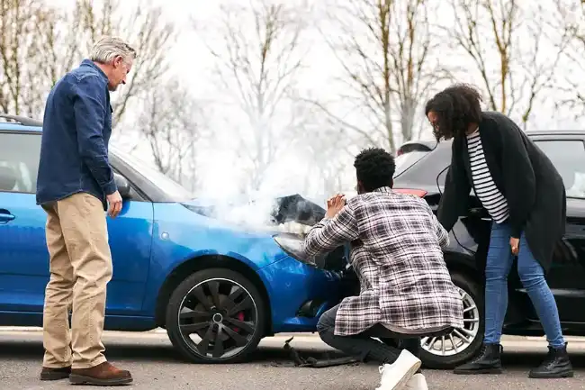 Personal injury victim taking pictures of car collision for evidence