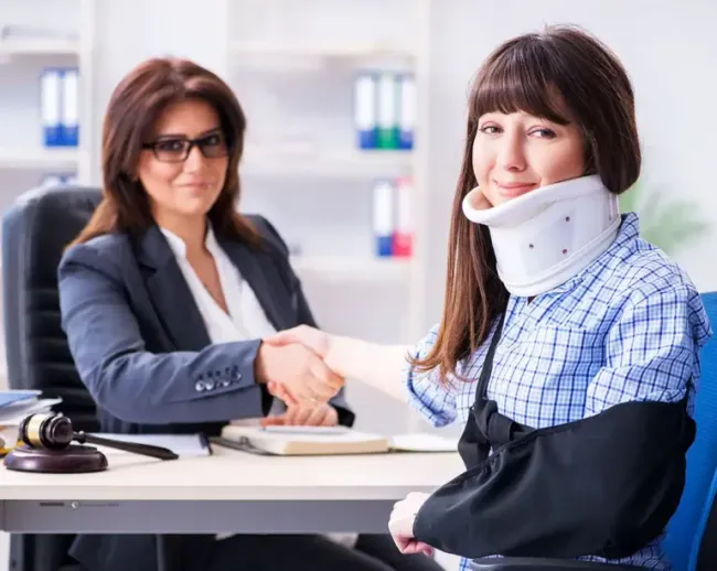 Spinal cord injury victim discussing compensation with an attorney.