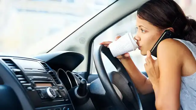 Talking on the phone and drinking coffee while driving can cause car accidents
