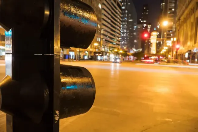 Traffic light on a roadway highlighting areas to slow down and prevent speeding-related accidents