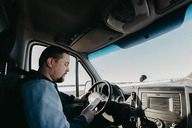 Truck accident risk as driver uses mobile phone while driving