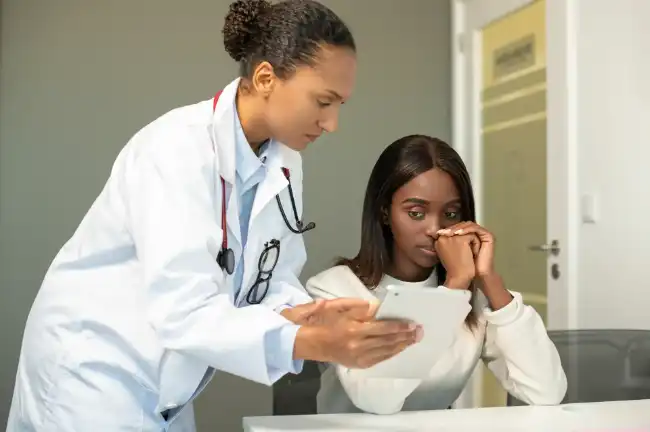 Uber accident victim talking with her doctor