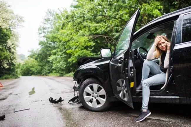Woman in a crashed vehicle after an Uber accident in Riverside, California