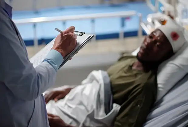 Lyft accident victim talking to doctor about his injuries