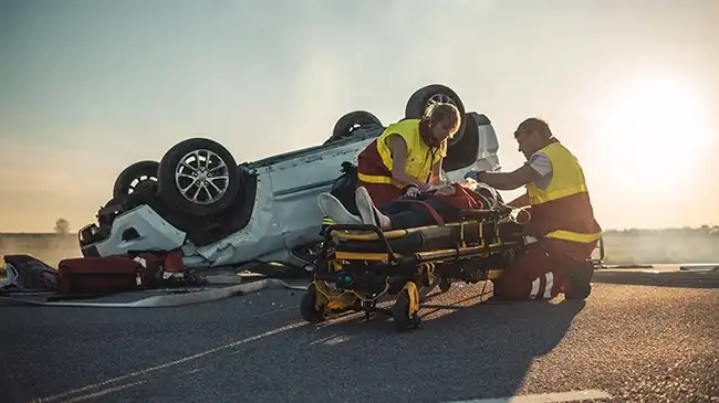 Rescue team helping an injured person in a stretcher after a car accident in Contra Costa