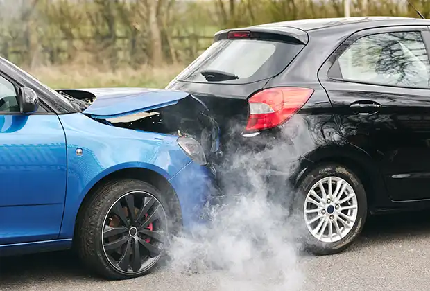 two damaged cars involved in road traffic accident