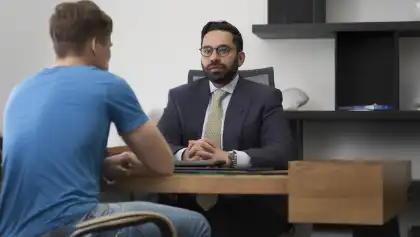 Freeway accident attorney consulting with injured client about multi-vehicle collision claim