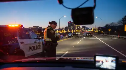 Police documenting crash scene evidence for personal injury investigation