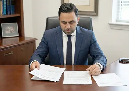 Defective tire accident attorney reviewing injury claim documents
