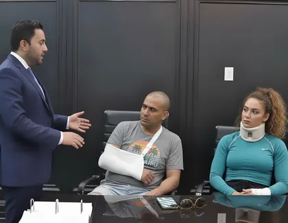 Injured car accident victims meeting with personal injury lawyer