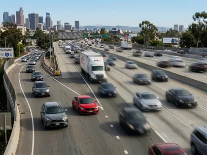 Cars merging onto a busy San Francisco freeway with heavy traffic