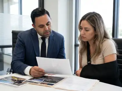 Attorney and client reviewing evidence together in an office setting