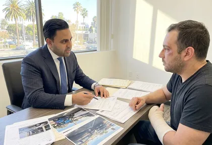 Attorney reviewing a parked car collision injury claim
