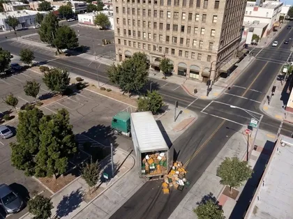 Aerial view of a truck accident in Fresno featuring a commercial box truck that lost its cargo at a city intersection