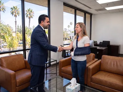 Pedestrian accident lawyer meeting with an injured client to review a claim