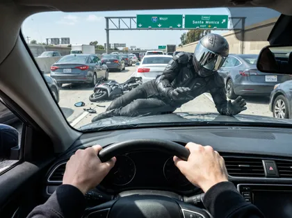 Car blocking a lane-splitting motorcyclist, causing a California motorcycle crash