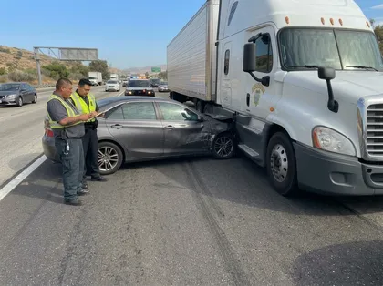 Commercial truck and car collision on a California highway