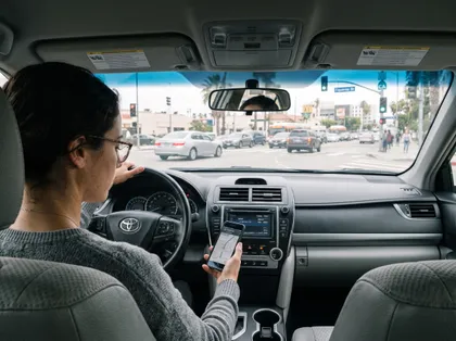 Driver using navigation in California traffic