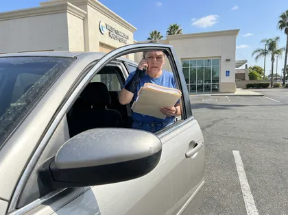 Injured patient reviewing medical bills after leaving a health clinic