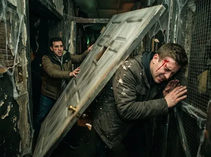California haunted house accident scene featuring an injured visitor struck by a heavy wooden door