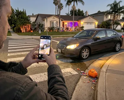 Parent documenting a Halloween pedestrian accident scene after a child is struck by a car in California