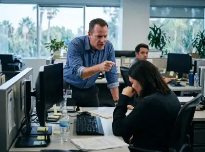 Supervisor confronting a distressed employee in the office